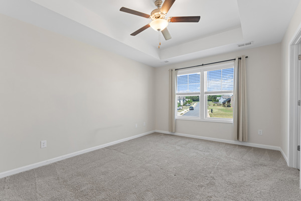 249 Samuel Street Pendleton, SC 29670 - Photo 18 of 33 This spacious bedroom offers comfortable carpeting and a large window with natural light.