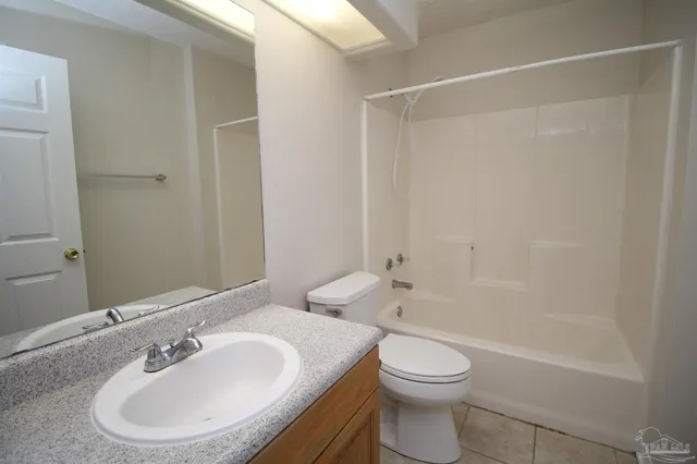 a bathroom with a toilet a sink and a bathtub