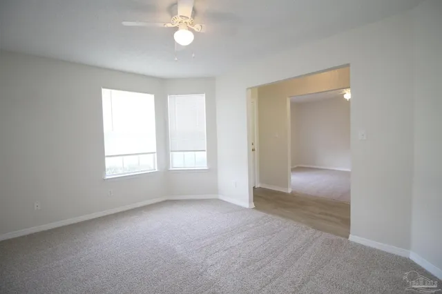 an empty room with a empty space and a window