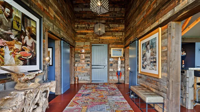 a living room with fireplace furniture and a large window