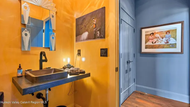 a kitchen with a stove a sink and a microwave