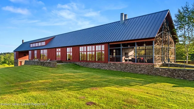 a view of a house with a yard porch and sitting area