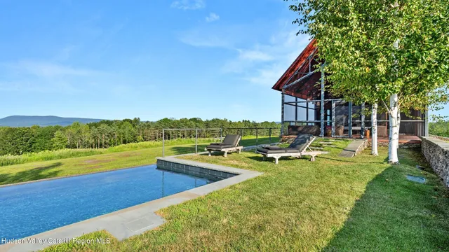 a bathroom with a large window and a sink