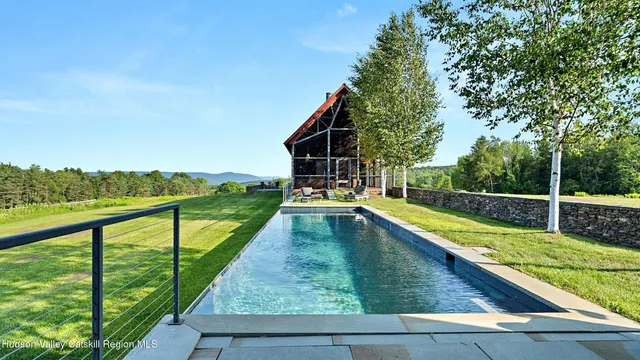 a bathroom with a mirror and a shower