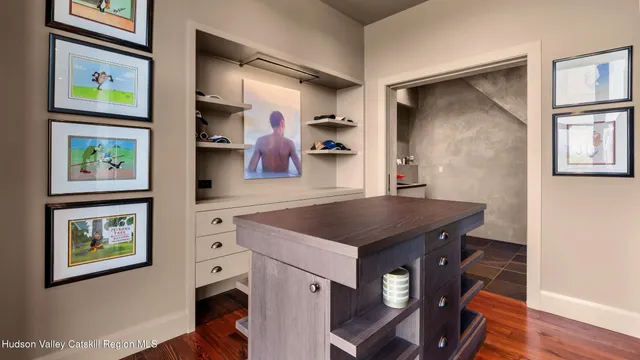 a view of a swimming pool with lawn chairs with plants