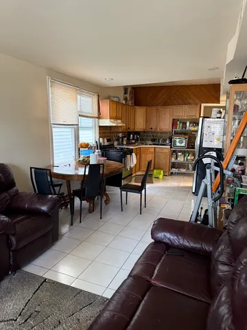 a living room with lots of furniture and a book