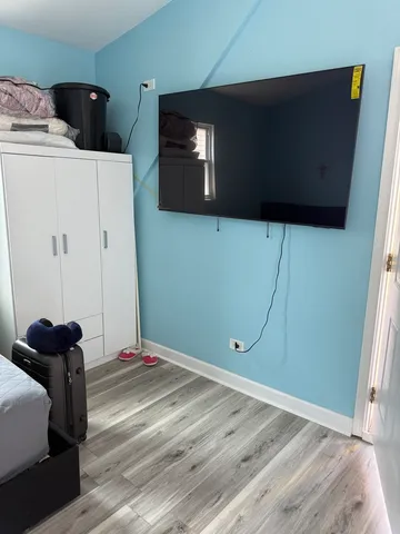 a view of a livingroom with wooden floor