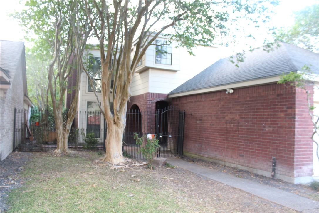 6706 Northgate Drive Corpus Christi, TX 78413 - Photo 1 of 8 a view of a house with a tree and a yard
