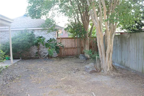 a view of backyard with green space