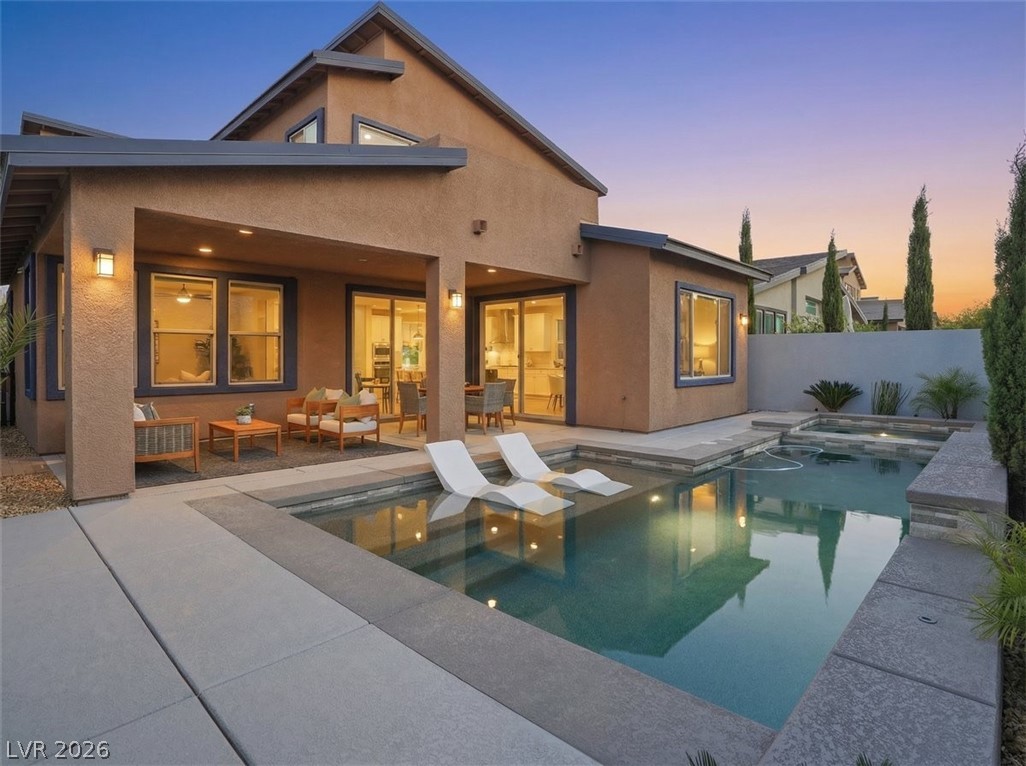 9725 Starlight Ridge Avenue Las Vegas, NV 89148 - Photo 2 of 47 This captivating exterior features a inviting patio and a sparkling pool, perfect for leisure.