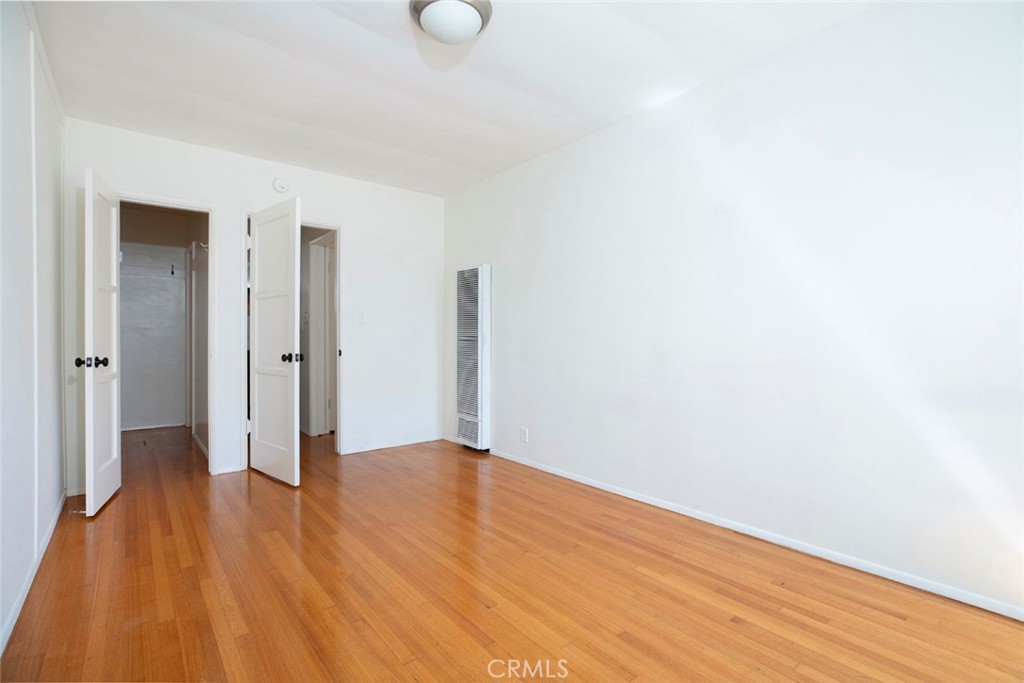 4135 Warner Boulevard, Unit B Burbank, CA 91505 - Photo 9 of 12 a view of an empty room with wooden floor