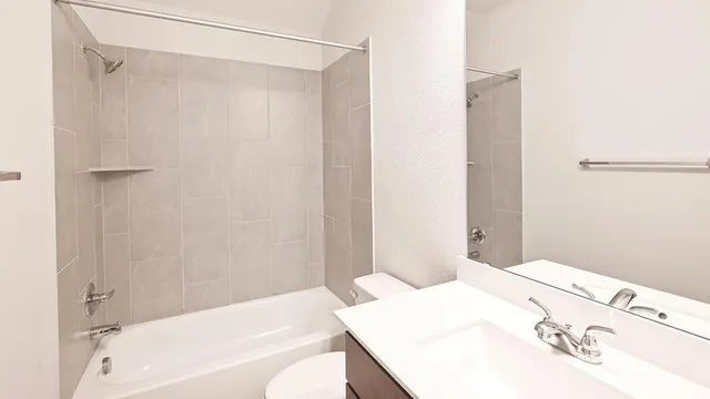 a bathroom with a bathtub and a sink