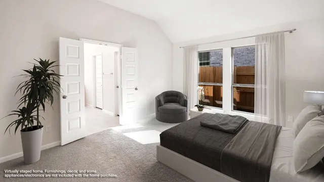 a bedroom with furniture and a window