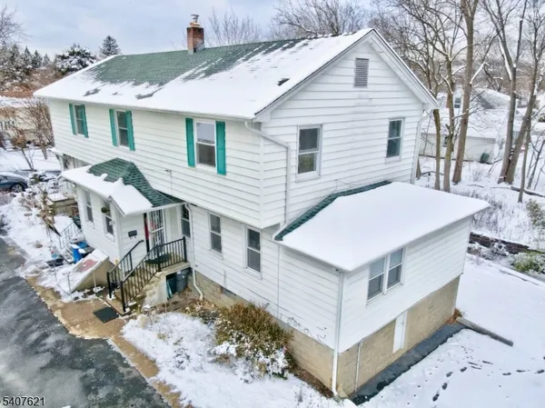 a aerial view of a house with a yard