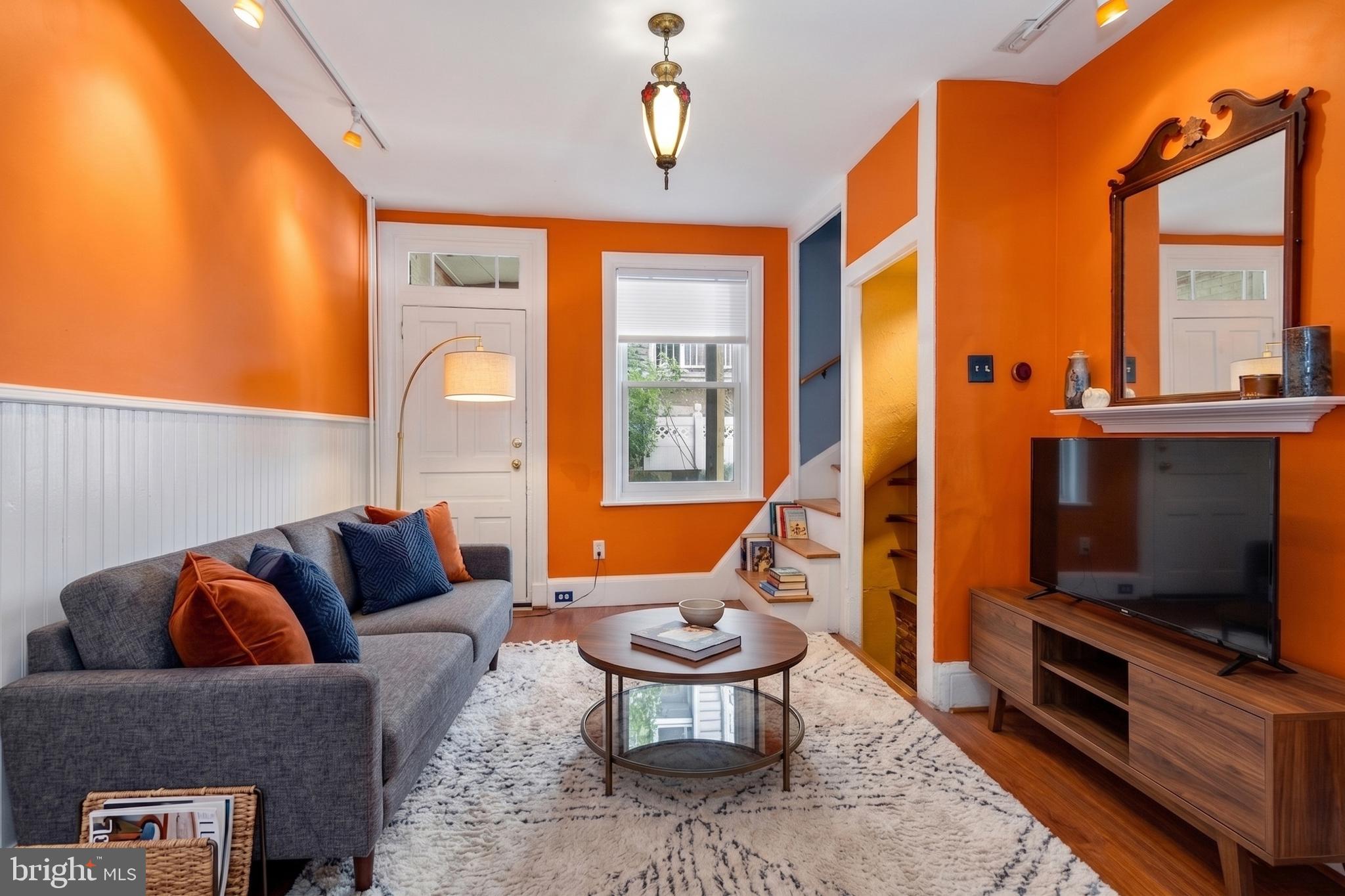 528 Kauffman Street Philadelphia, PA 19147 - Photo 1 of 32 a living room with furniture a flat screen tv and a window