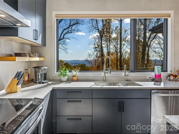a kitchen with a sink and a stove