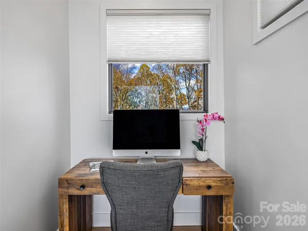 a room with furniture and a flat screen tv