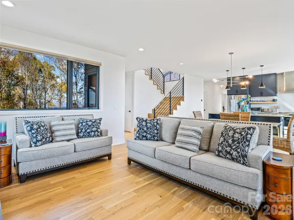 a living room with furniture and a large window