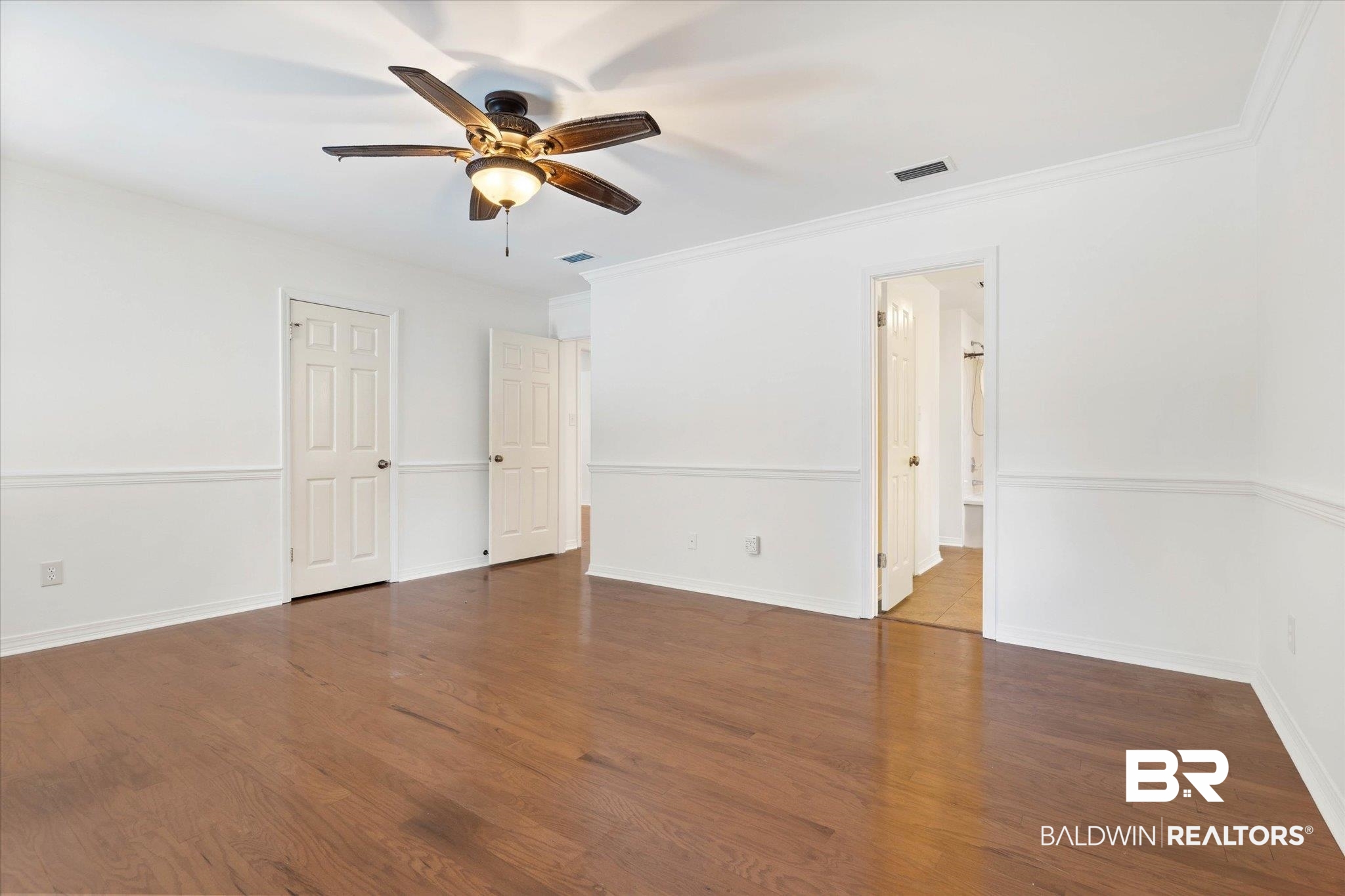 3032 Autumn Ridge Drive West Mobile, AL 36695 - Photo 11 of 20 Spare room featuring ceiling fan, wood finished floors, and crown molding
