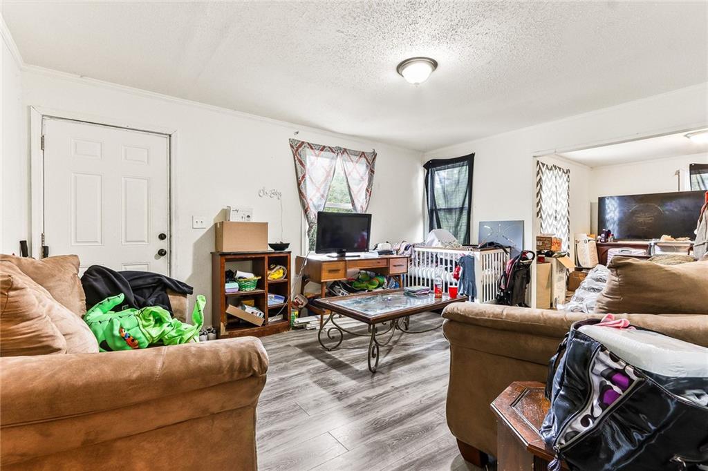2231 Penelope Street Northwest Atlanta, GA 30314 - Photo 12 of 23 a living room with furniture and a flat screen tv