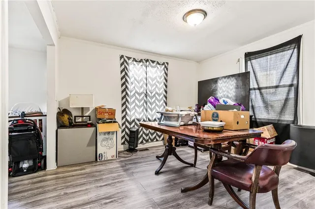 a view of a dining room with furniture and a window