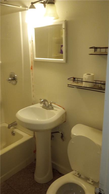 2231 Penelope Street Northwest Atlanta, GA 30314 - Photo 18 of 23 a bathroom with a sink and mirror with toilet