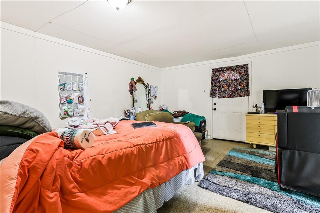 2231 Penelope Street Northwest Atlanta, GA 30314 - Photo 22 of 23 a bedroom with bed and tv