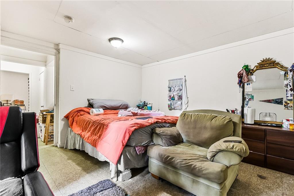 2231 Penelope Street Northwest Atlanta, GA 30314 - Photo 9 of 23 a bedroom with a bed and couch