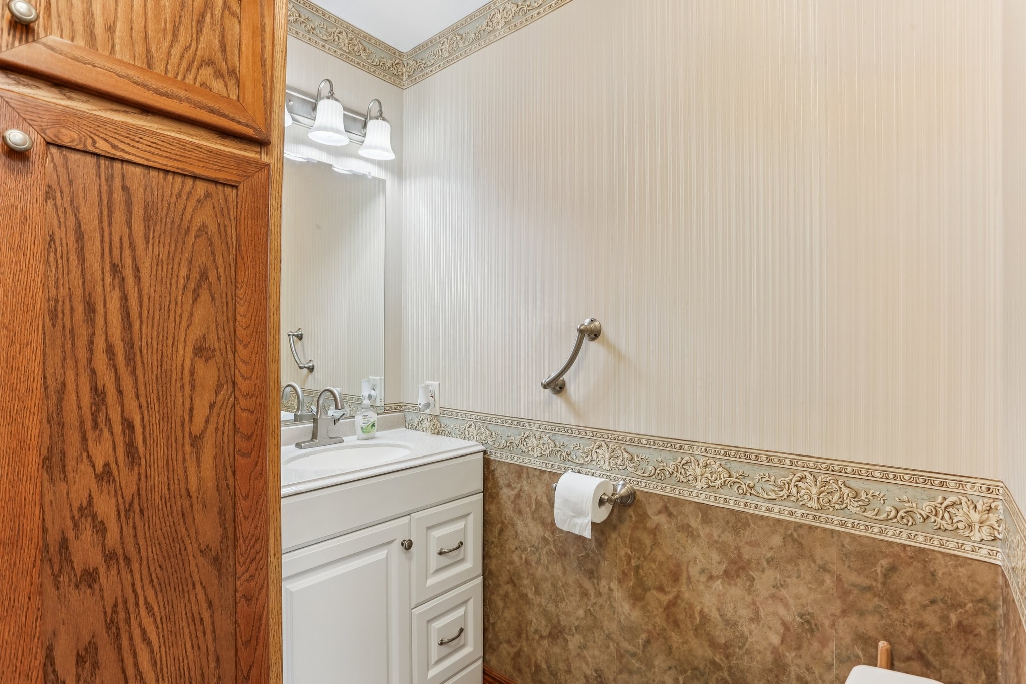441 Marilyn Circle Spring Hill, TN 37174 - Photo 16 of 50 a bathroom with a sink and a mirror