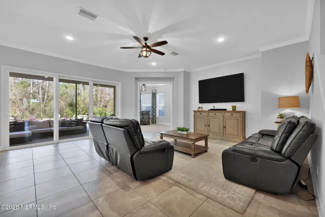 a living room with furniture and a table