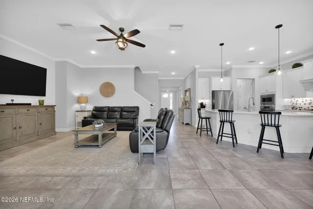 a bathroom with a double vanity sink mirror and shower