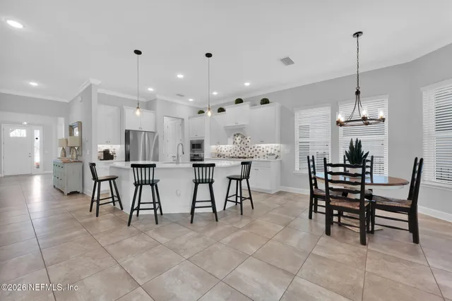a bathroom with a tub a toilet and a shower
