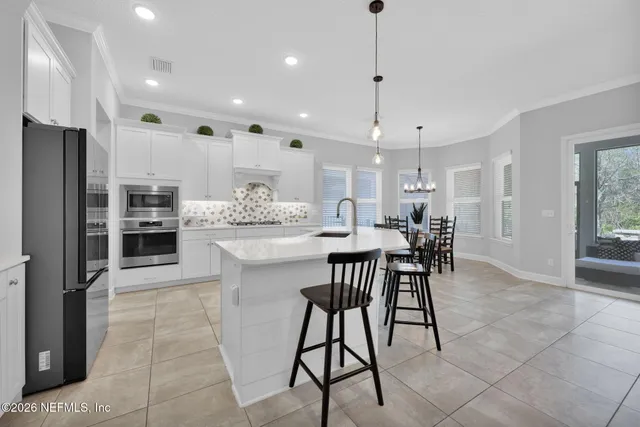 a bathroom with a tub a sink and mirror