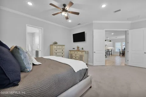 a view of a patio with a table and chairs under an umbrella