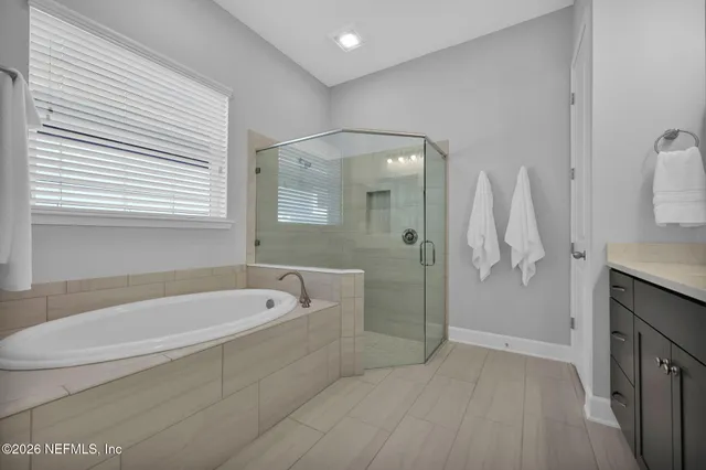 a view of a patio with table and chairs potted plants and large trees