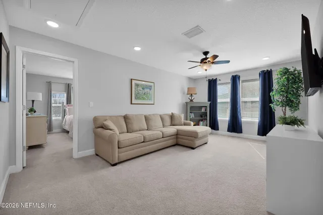 an aerial view of a house with swimming pool and mountains