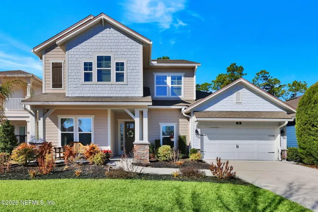 a view of a dining area with furniture window and wooden floor
