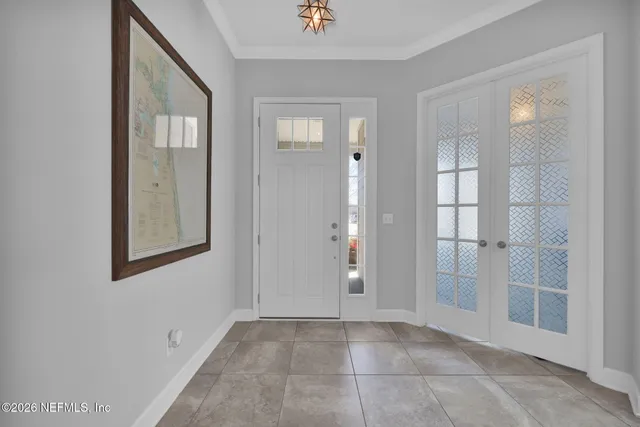 a dining room with furniture and potted plant