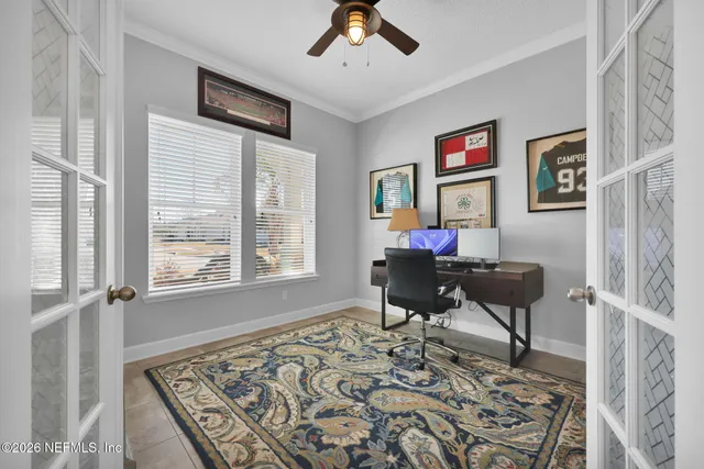 a bathroom with a toilet a sink a mirror and vanity