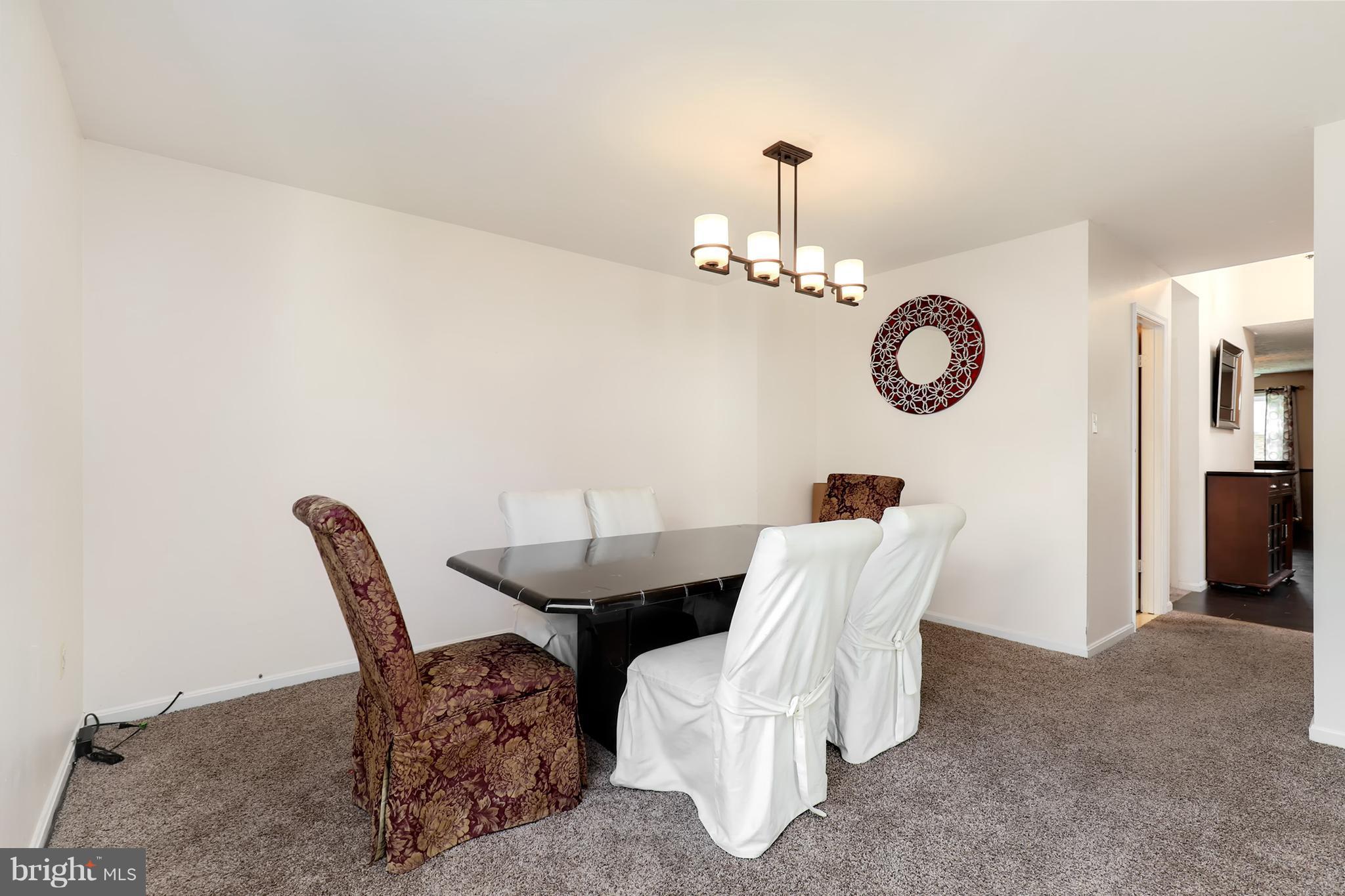 10604 Gator Court Clinton, MD 20735 - Photo 15 of 24 a view of a dining room with furniture and a mirror