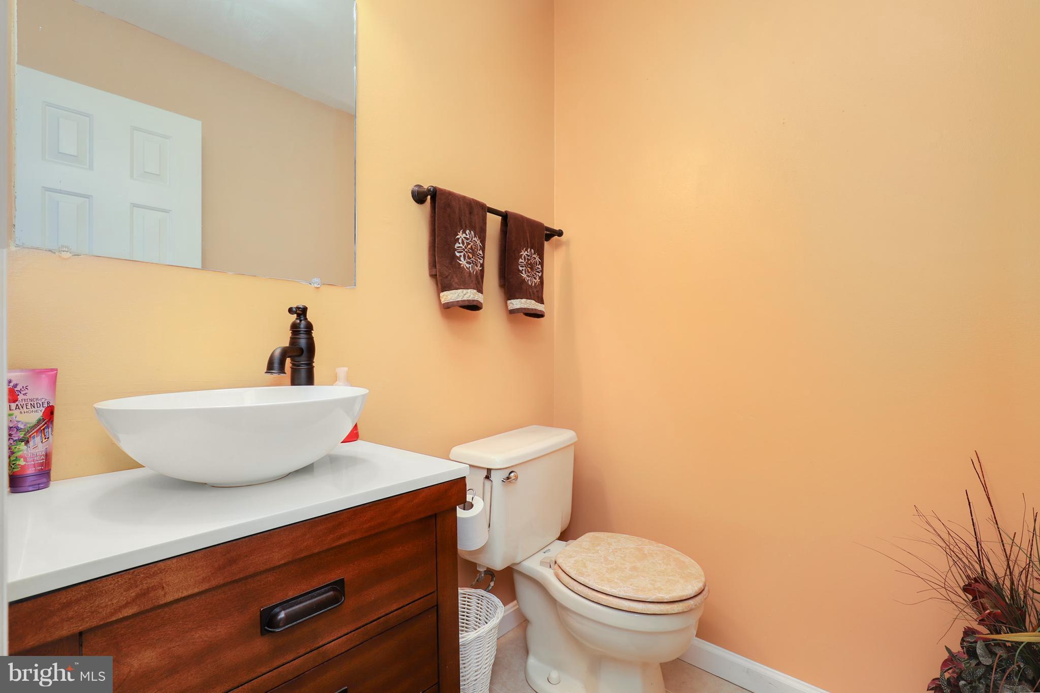 10604 Gator Court Clinton, MD 20735 - Photo 16 of 24 a bathroom with a toilet and a sink