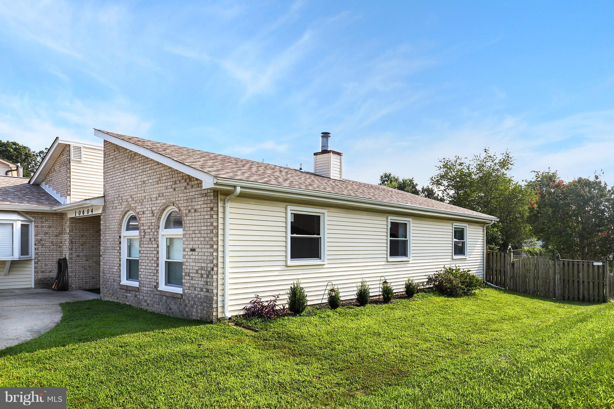 10604 Gator Court Clinton, MD 20735 - Photo 4 of 24 a front view of a house with a yard