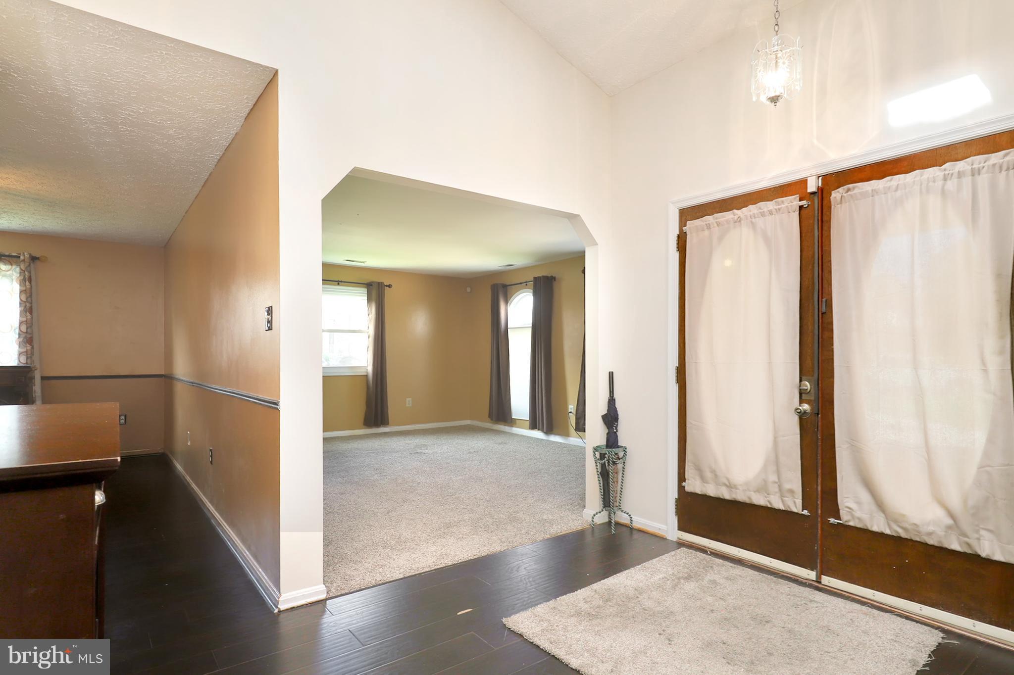10604 Gator Court Clinton, MD 20735 - Photo 7 of 24 a view of a hallway with wooden floor and staircase