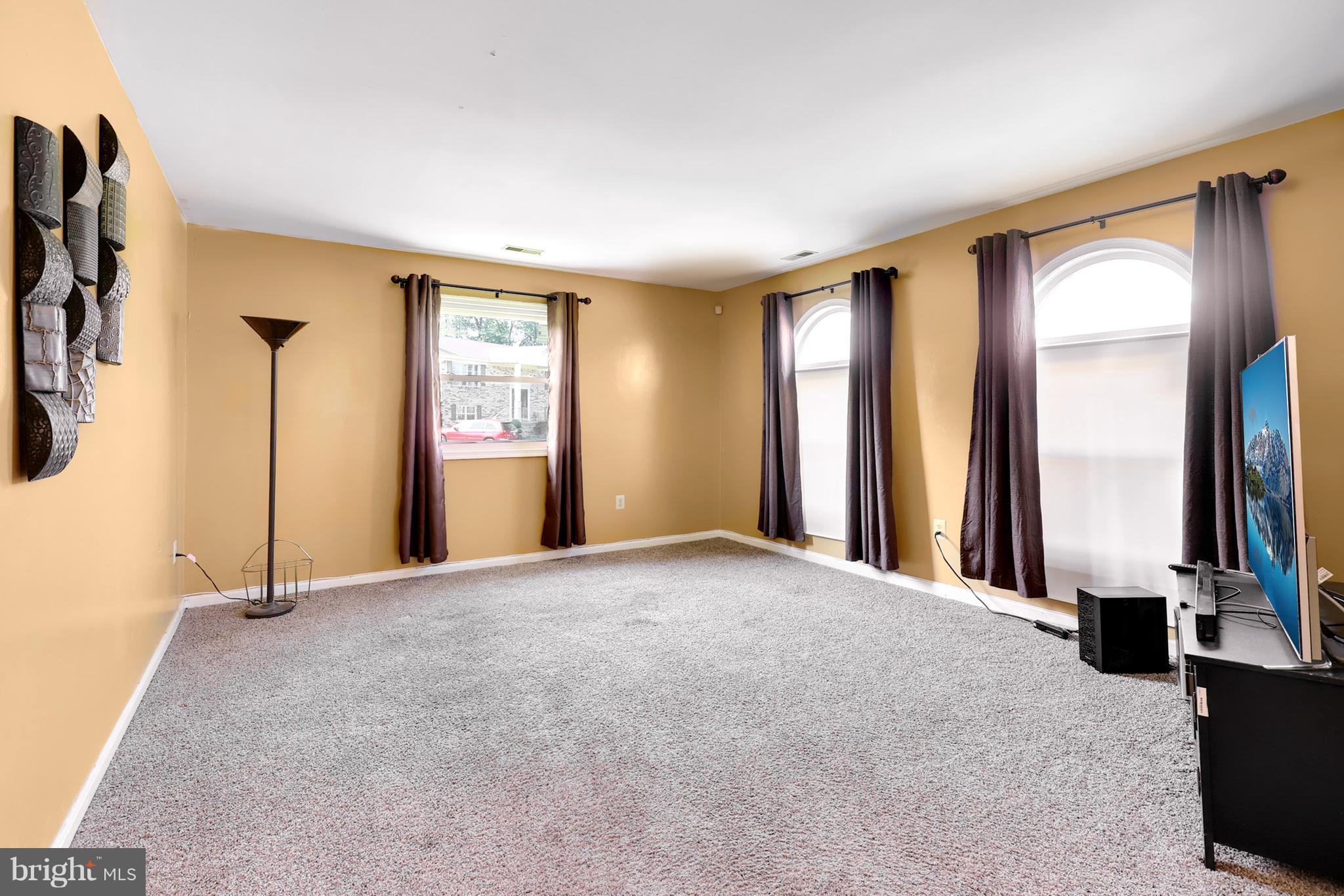 10604 Gator Court Clinton, MD 20735 - Photo 8 of 24 a view of an empty room with a fireplace