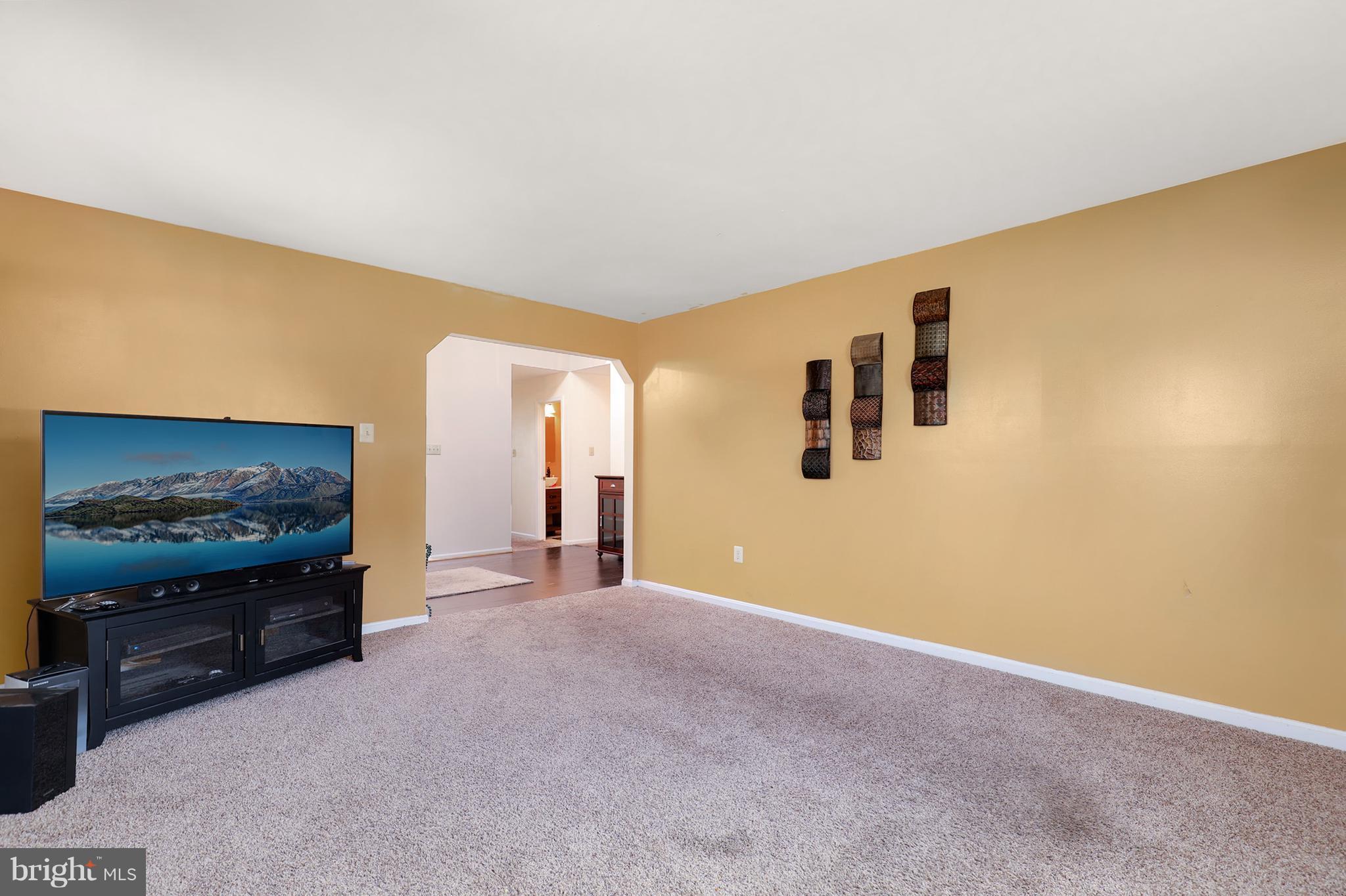 10604 Gator Court Clinton, MD 20735 - Photo 9 of 24 a view of livingroom with furniture and flat screen tv
