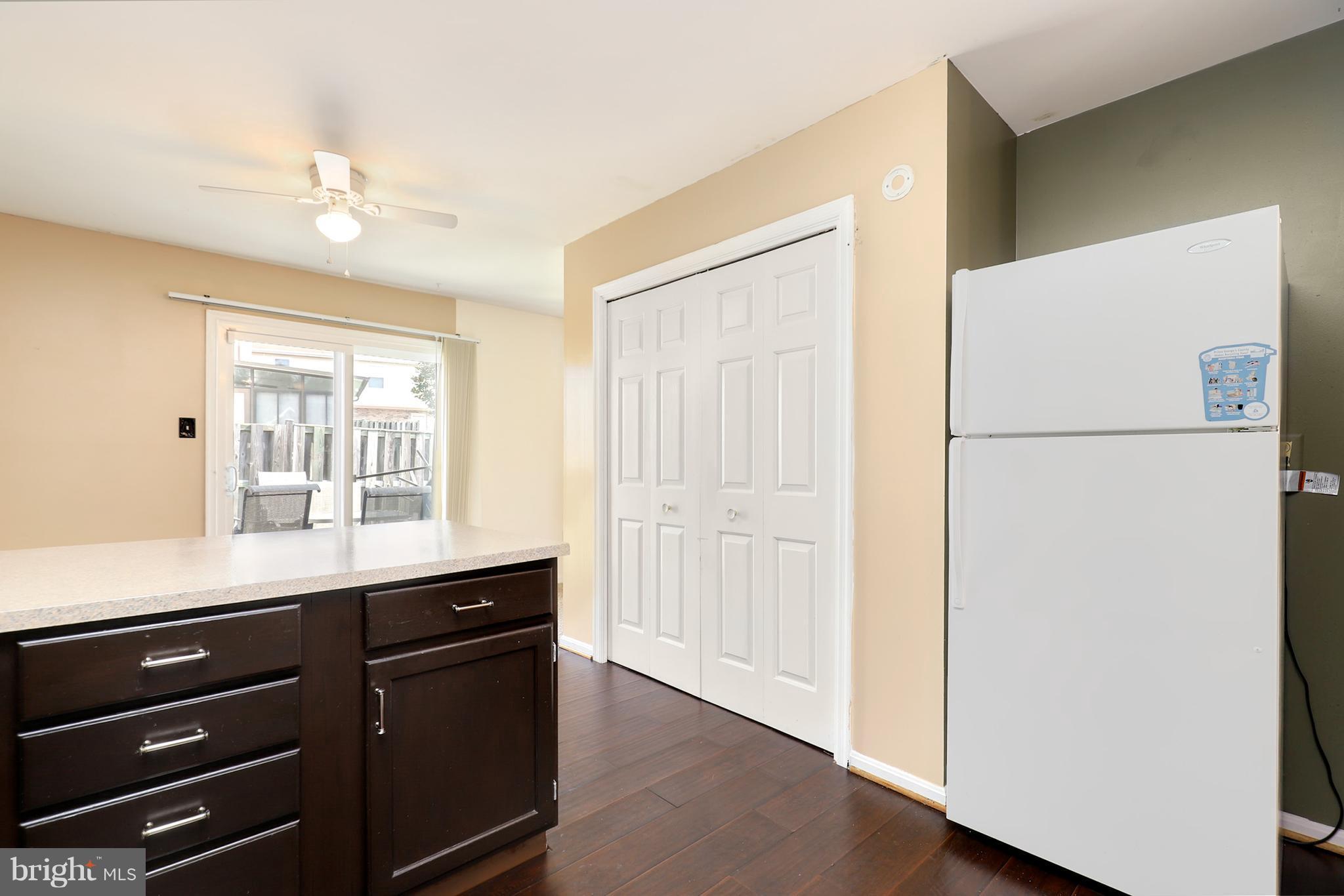 10604 Gator Court Clinton, MD 20735 - Photo 10 of 24 a kitchen with a refrigerator and a sink