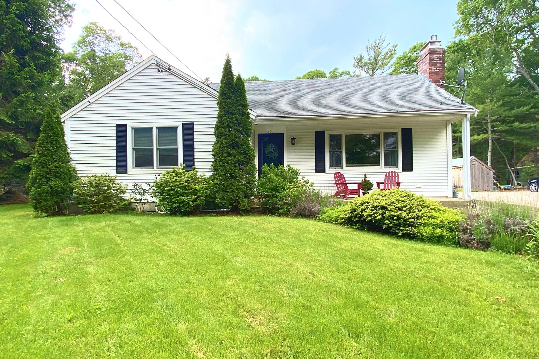 a view of a house with garden and yard