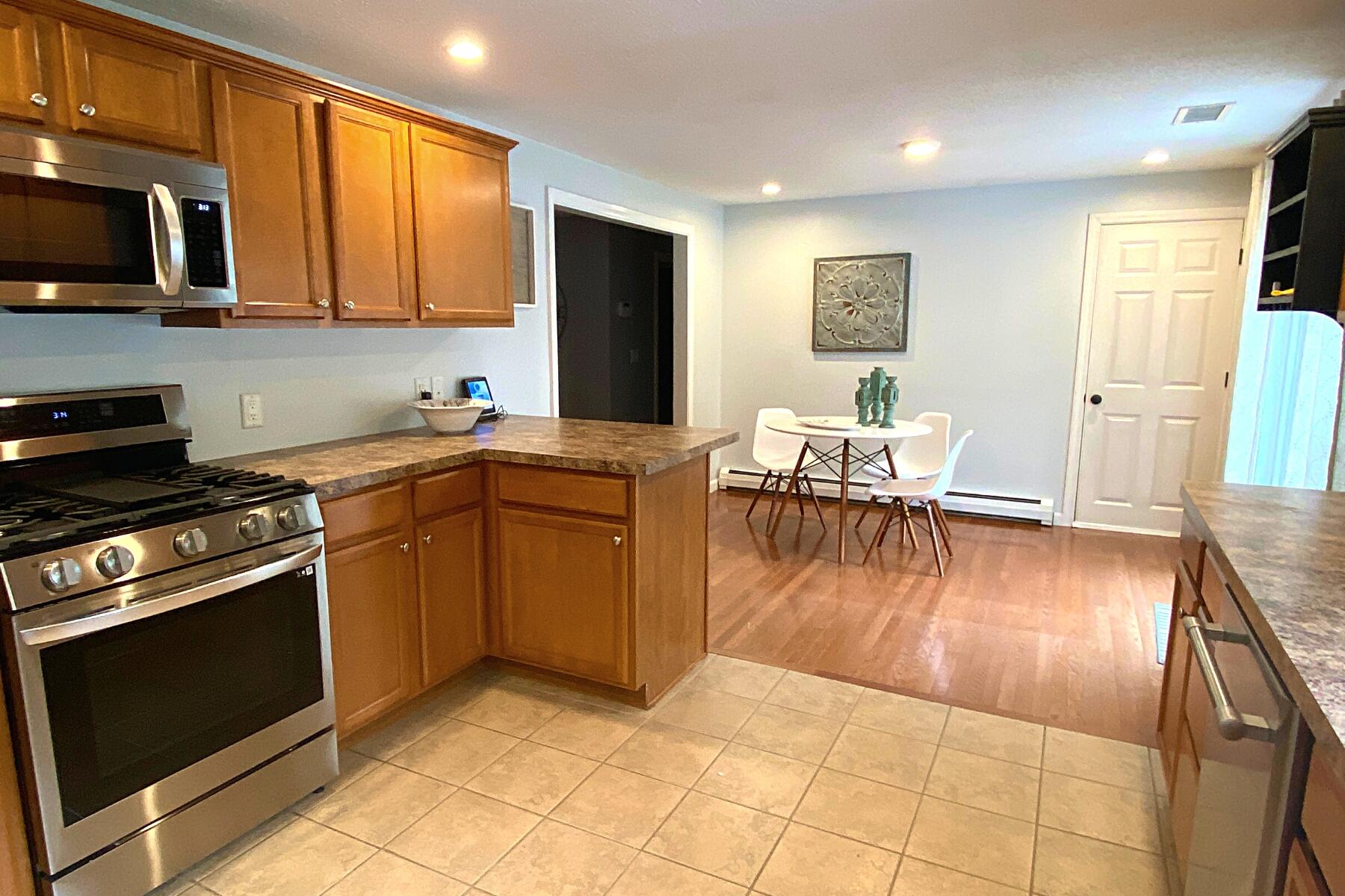 263 Cammett Road Marstons Mills, MA 02648 - Photo 13 of 33 a kitchen with a sink appliances and cabinets