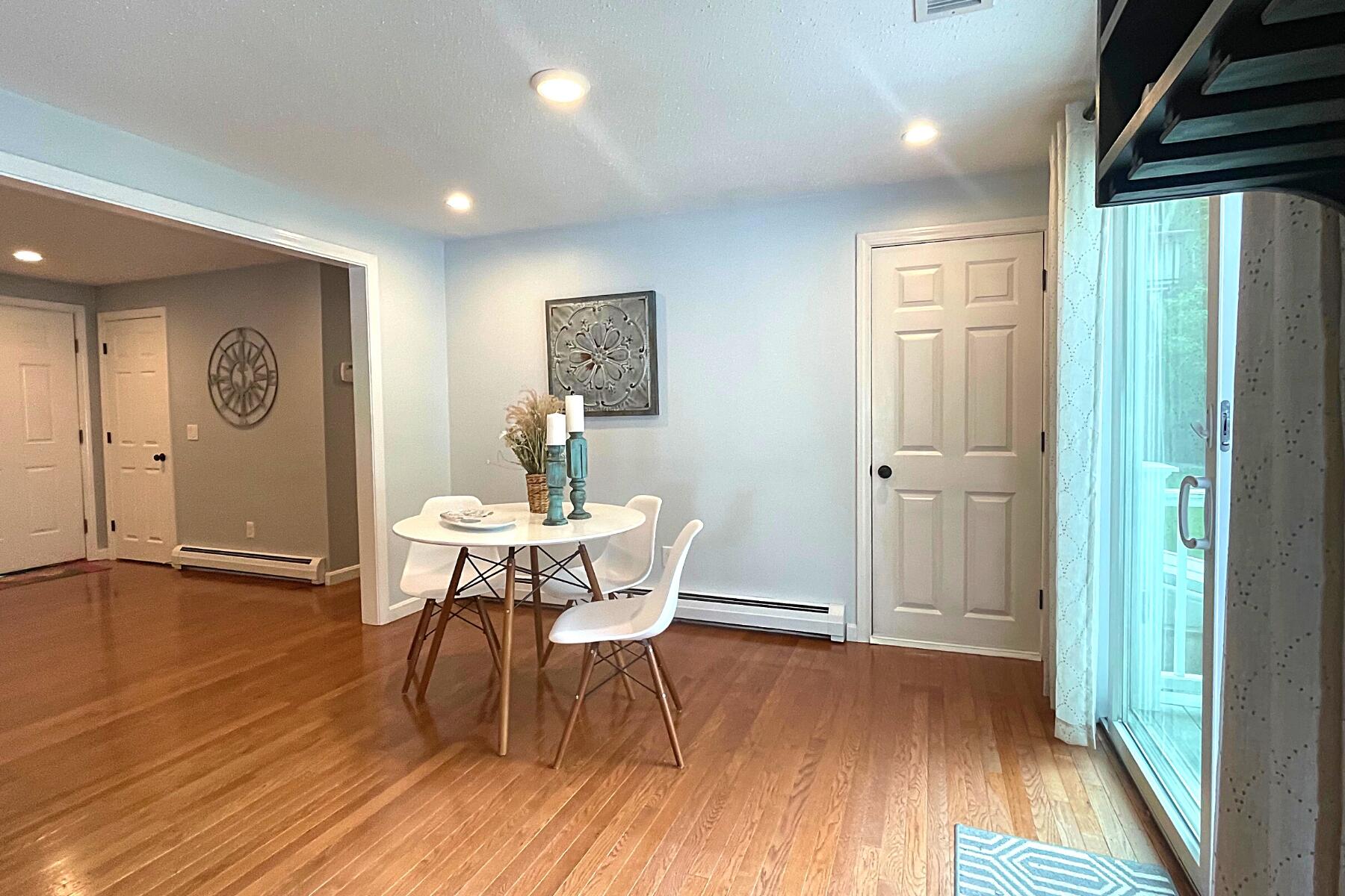 263 Cammett Road Marstons Mills, MA 02648 - Photo 15 of 33 a view of a dining room with furniture window and wooden floor