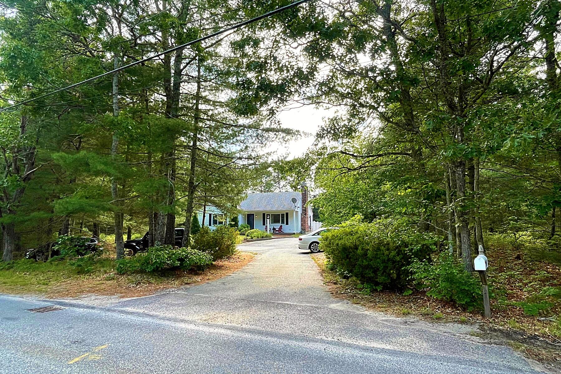 263 Cammett Road Marstons Mills, MA 02648 - Photo 2 of 33 a front view of a house with yard and green space